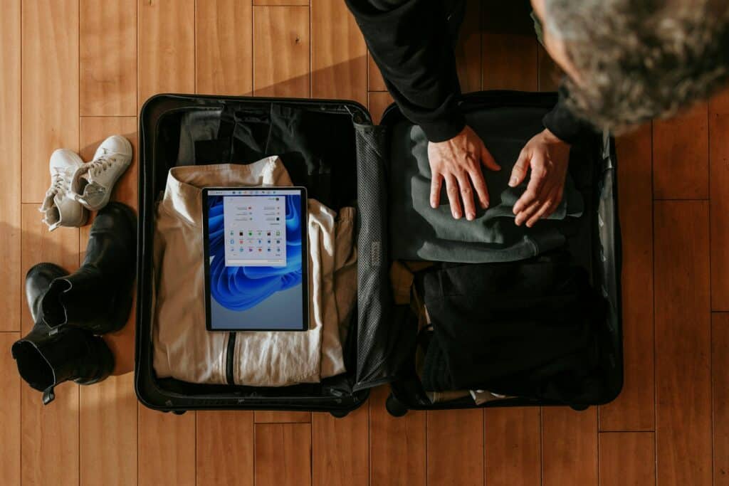 A person packing their luggage